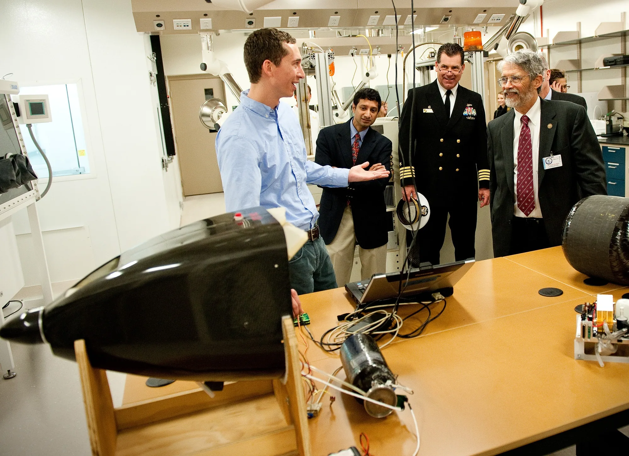 Ion Tiger aircraft nose and separate components on a laboratory bench during an NRL demonstration to visitors in 2012.