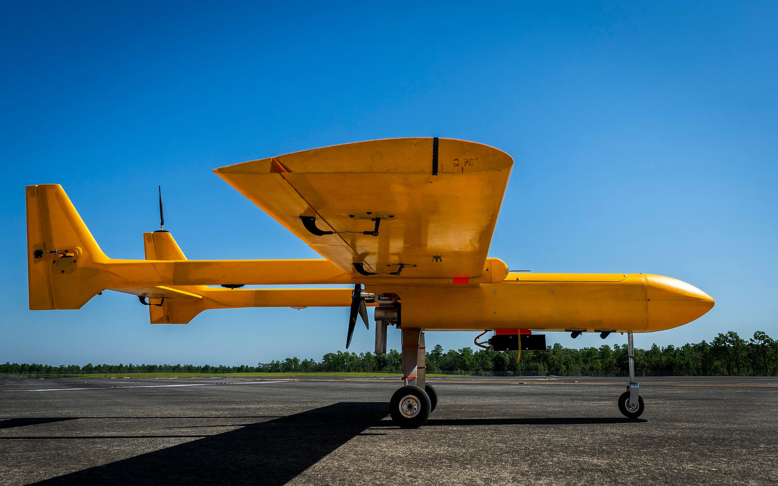 Yellow Osprey MK-III uncrewed aircraft on a runway before an alternative-navigation flight test at Eglin Air Force Base in 2025